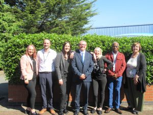 Group image of HICA training team standing outside, smiling