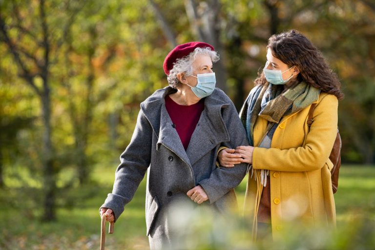 Carer and patient with masks on